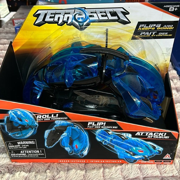 TERRASECT R/C TRANSFORMING VEHICLE, BLUE, 2.4 Ghz, 13.8 ROLLS FLIPS - Picture 1 of 3